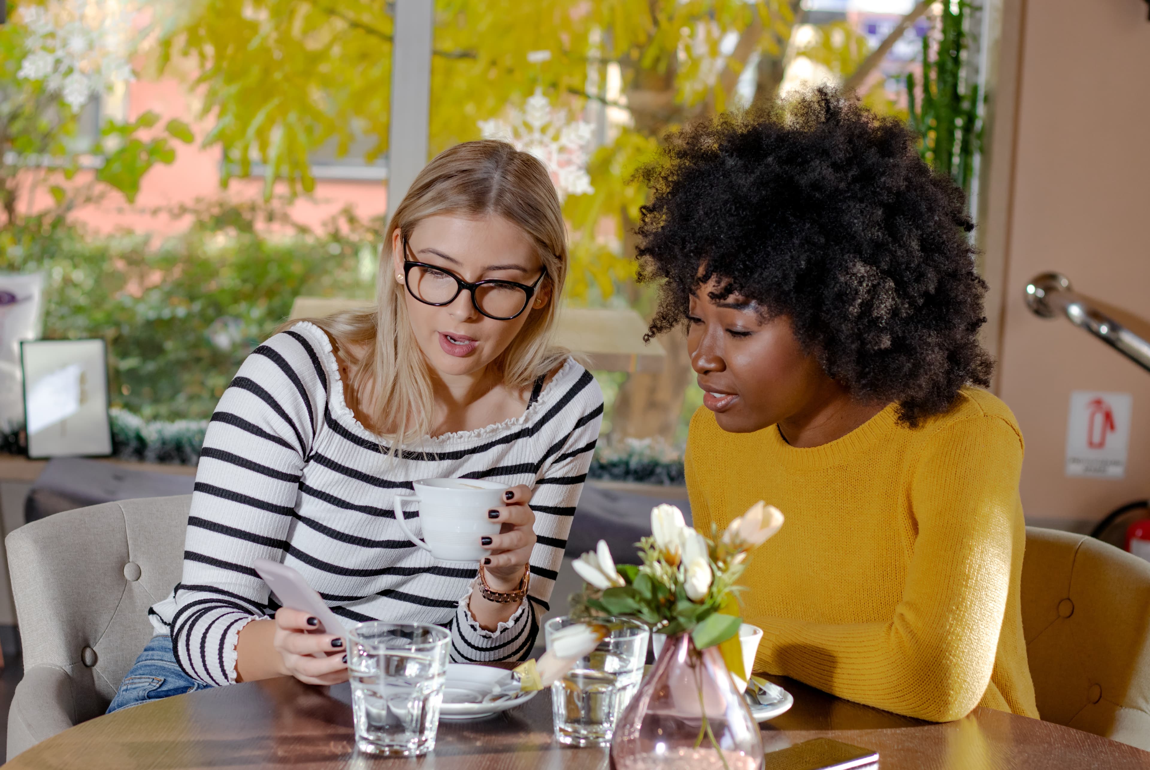 Woman smiling and talking to friends